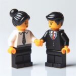 Lego dando un saludo de mano por un excelente acuerdo negociado